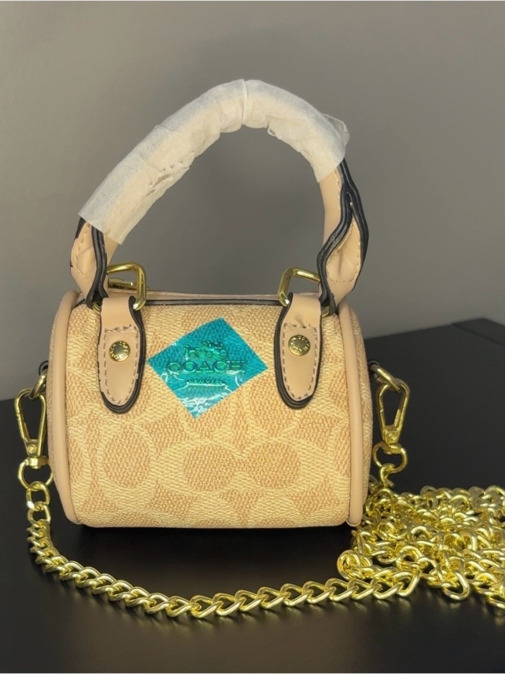 Coach Beige Mini Barrel Bag with Gold Chain and Teal Accent